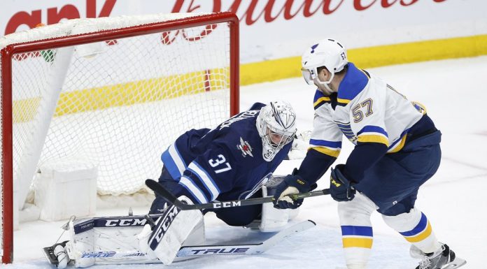 Perron scores in OT; Blues win 7th straight, 5-4 over Jets