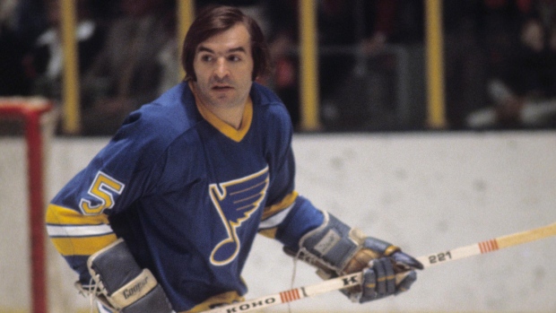 The Blues' Bobby Plager helps break in the ice at the team's new